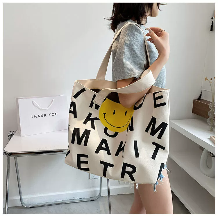 smily face black canvas bag